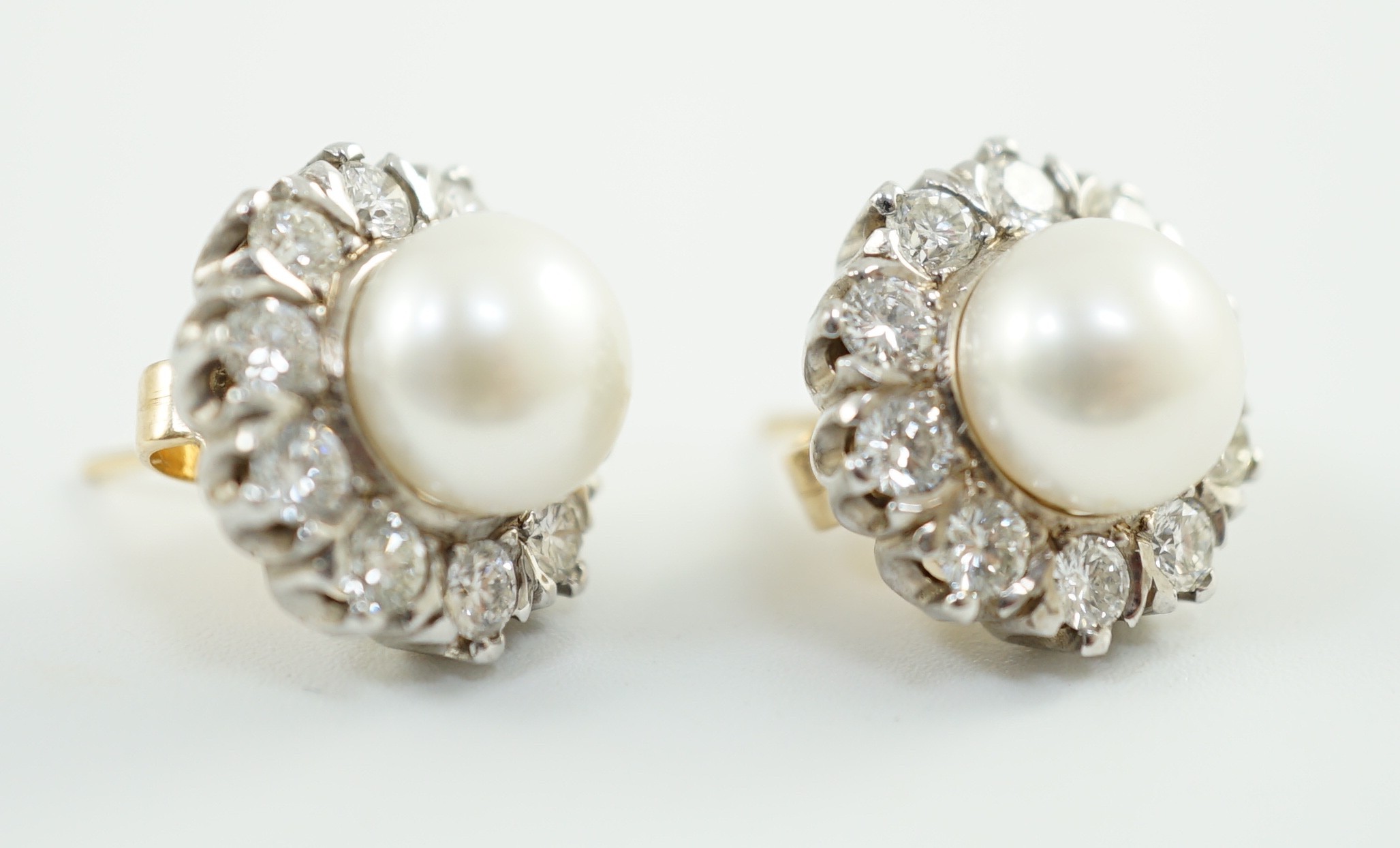 A pair of white gold? cultured pearl and diamond cluster set circular earrings